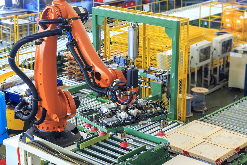 An orange Industrial Robot - Gears and Pulleys in Industrial Robots